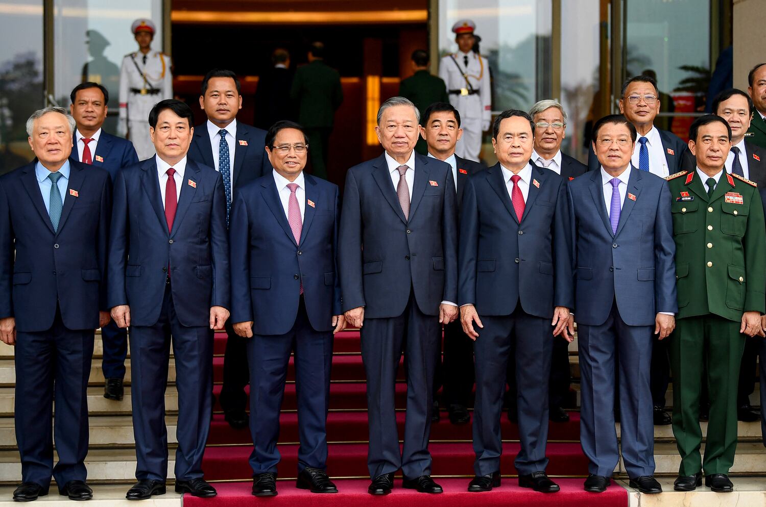 (From second left) Luong Cuong, then permanent member of the Secretariat of the Vietnam communist party, Prime Minister Pham Minh Chinh, Communist party General Secretary To Lam and National Assembly chairman Tran Thanh Man along with other officials pose for a group photo before attending the autumn opening session at the National Assembly in Hanoi on Oct. 21, 2024.